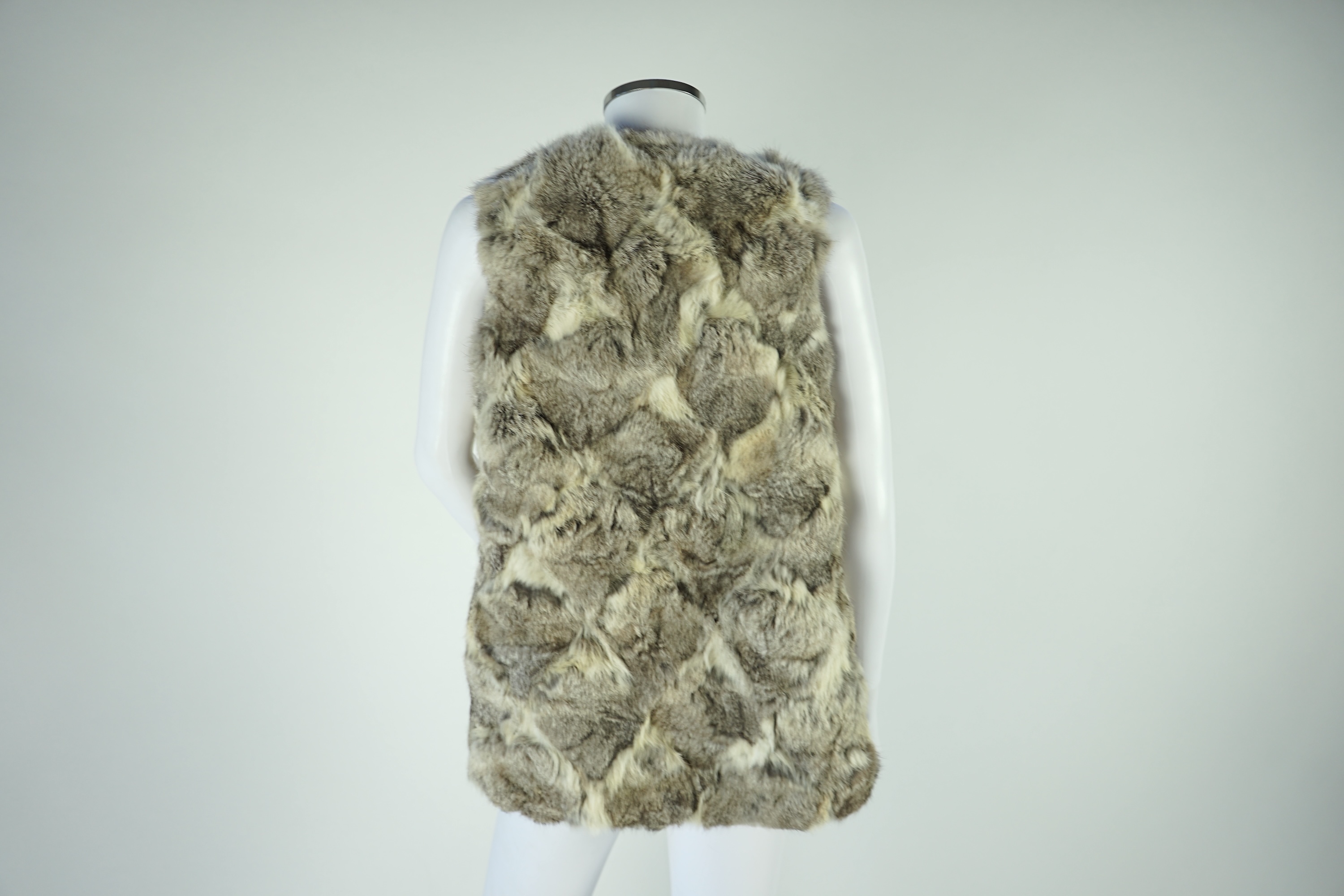 A selection of fur scarves and a fur gilet